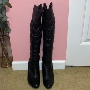 Heel black boot over the knee